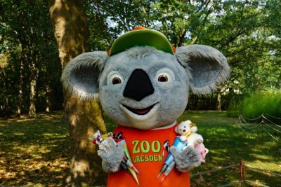 Zoo mascot Koali with sugar cones in his hands.